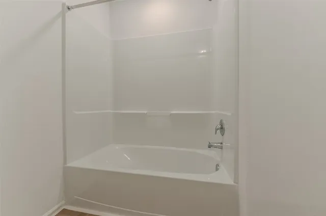 a view of kitchen with cabinets and wooden floor