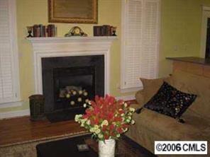8313 Strandhill Road Huntersville, NC 28078 - Photo 3 of 8 a living room with furniture and a fireplace