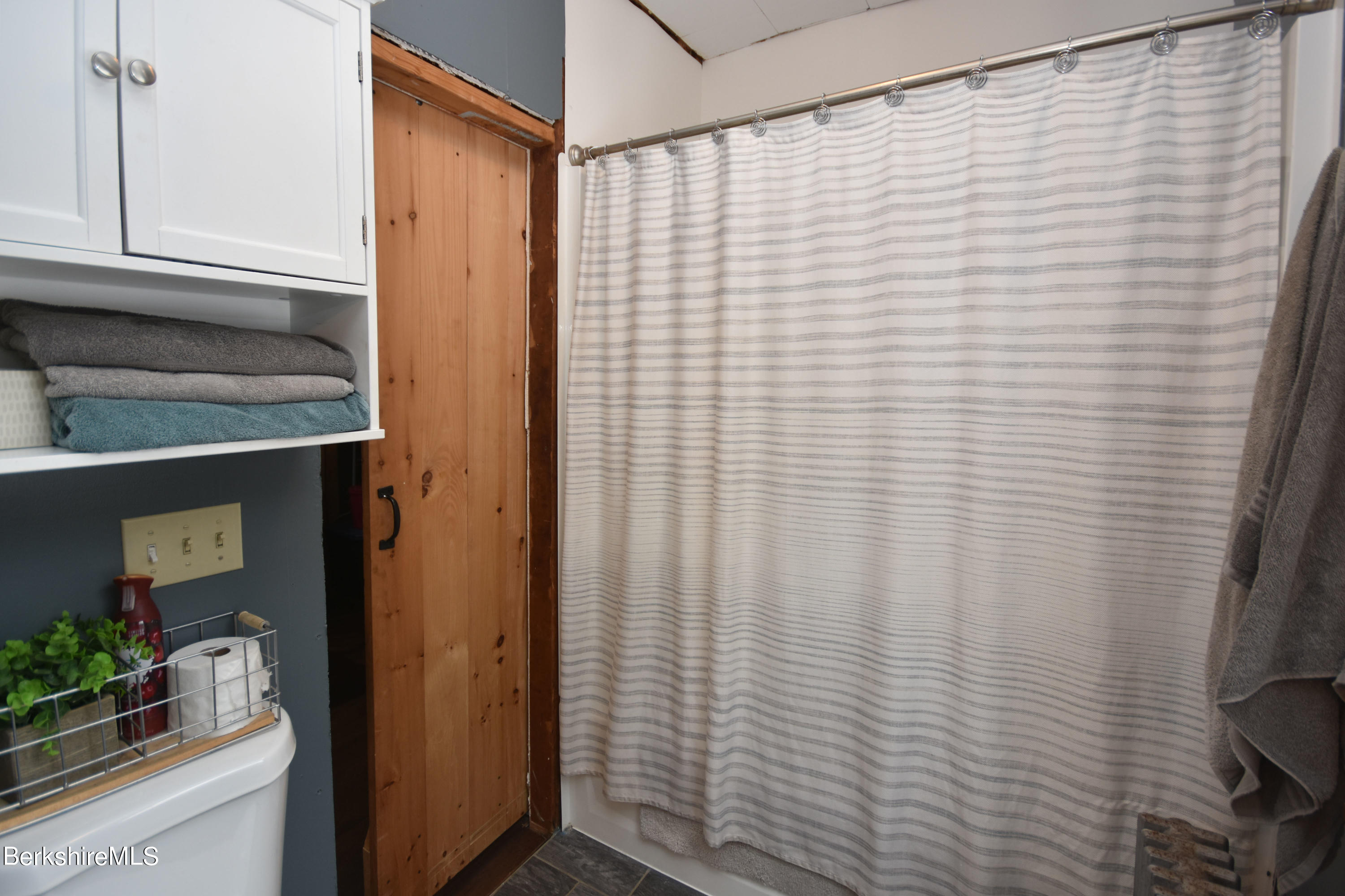 69 Town Hill Road Middlefield, MA 01235 - Photo 22 of 35 a bathroom with a shower curtain and sink