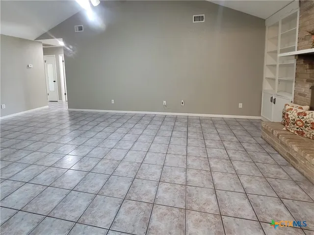 a view of an empty room and window