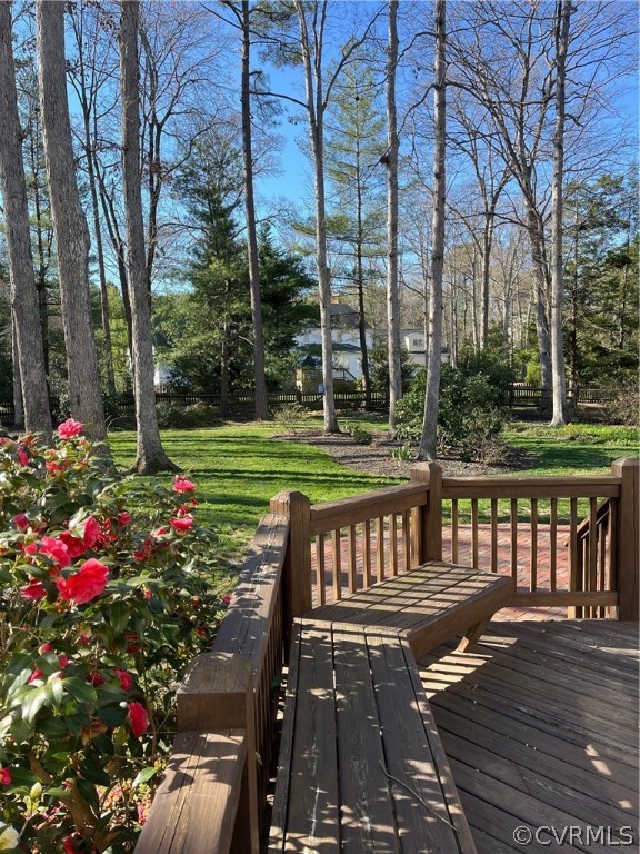 14110 Helmsley Road Midlothian, VA 23113 - Photo 6 of 6 a view of a patio with a table chairs and a yard