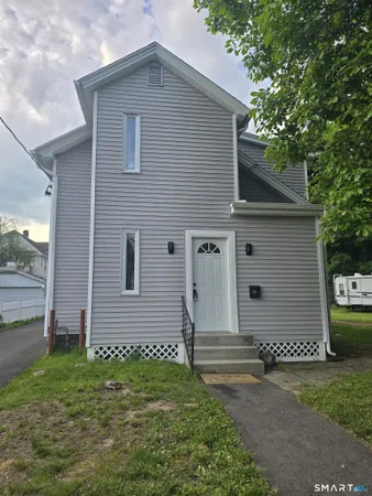 a view of a house with a yard