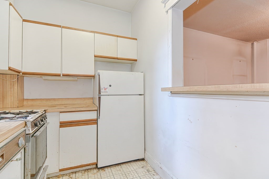 22 Orkney Road, Unit 5 Boston, MA 02135 - Photo 15 of 42 a utility room with dryer and washer