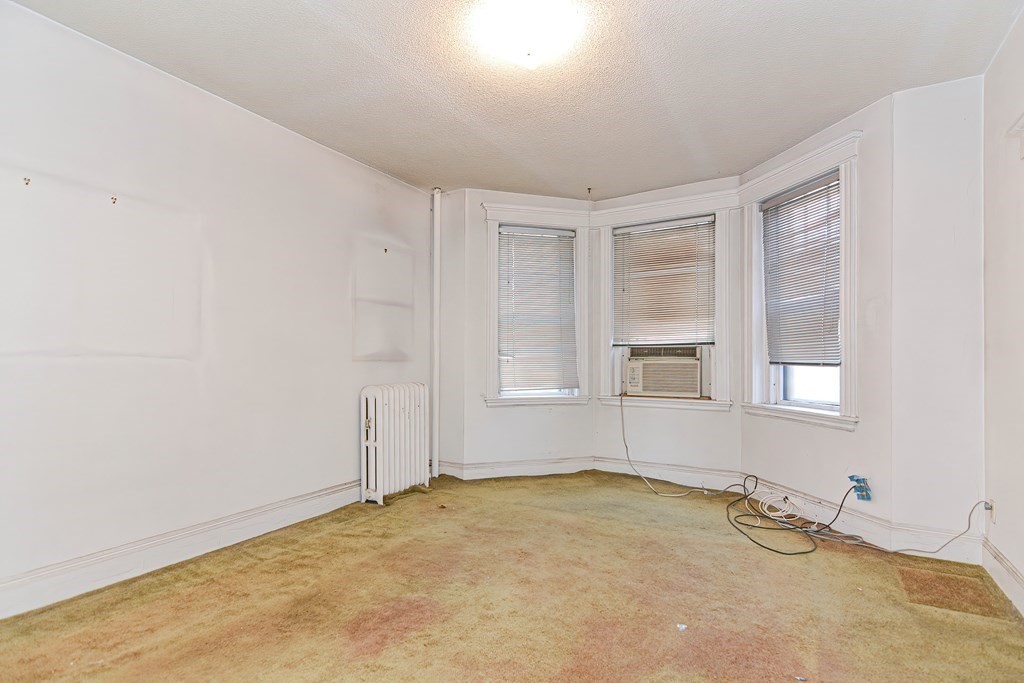 22 Orkney Road, Unit 5 Boston, MA 02135 - Photo 17 of 42 an empty room with a window