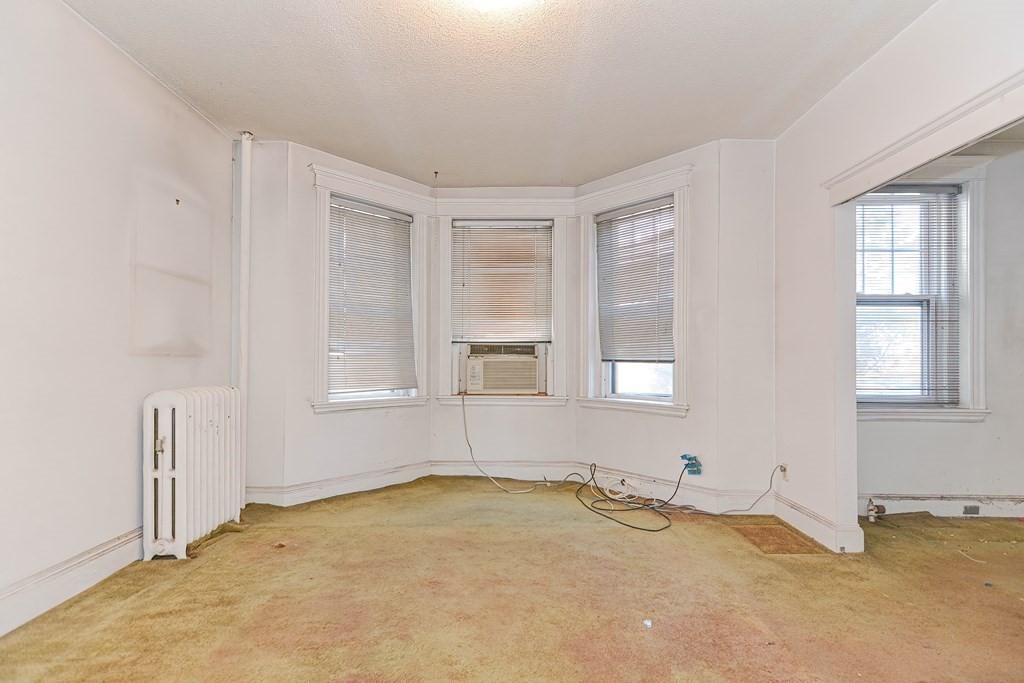 22 Orkney Road, Unit 5 Boston, MA 02135 - Photo 18 of 42 an empty room with a window