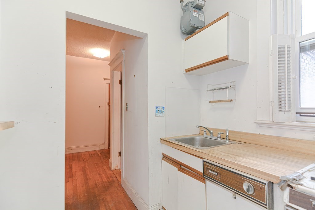 22 Orkney Road, Unit 5 Boston, MA 02135 - Photo 20 of 42 a bathroom with a sink and a mirror