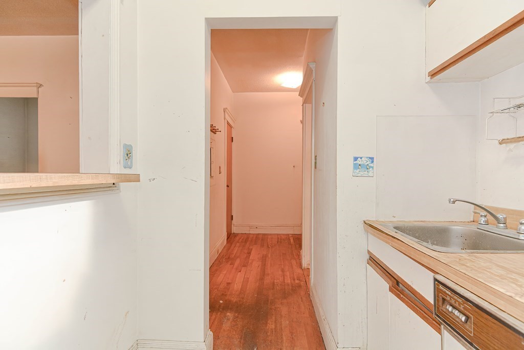 22 Orkney Road, Unit 5 Boston, MA 02135 - Photo 21 of 42 a view of a kitchen from a hallway
