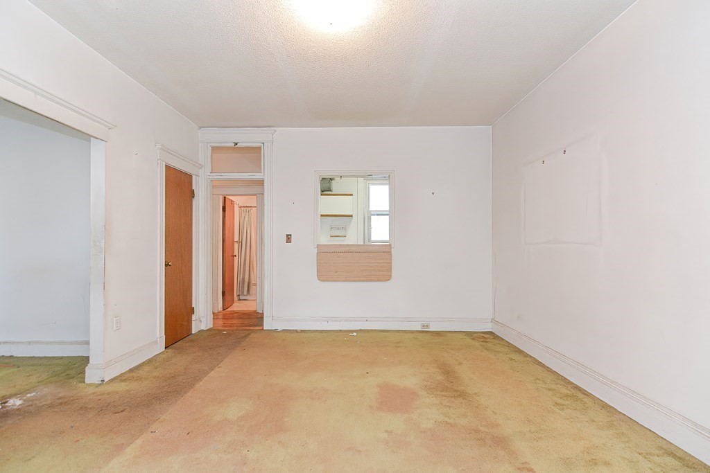 22 Orkney Road, Unit 5 Boston, MA 02135 - Photo 23 of 42 an empty room with windows