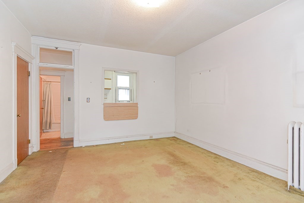 22 Orkney Road, Unit 5 Boston, MA 02135 - Photo 24 of 42 an empty room with windows
