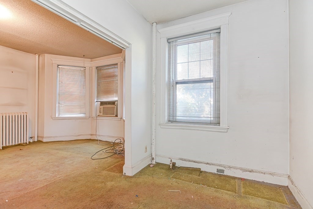 22 Orkney Road, Unit 5 Boston, MA 02135 - Photo 27 of 42 an empty room with windows
