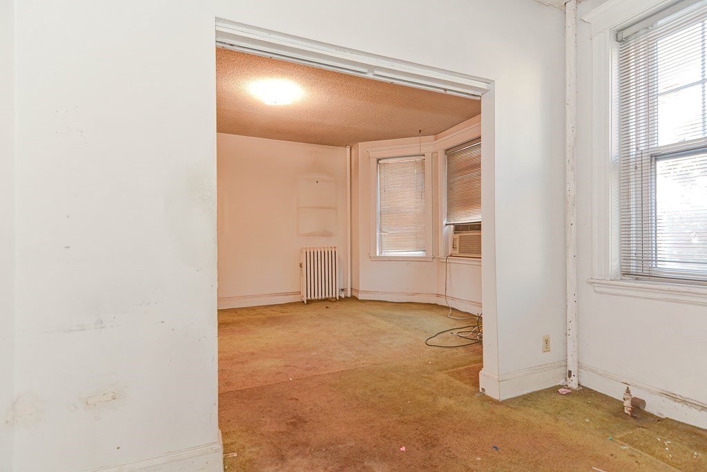 22 Orkney Road, Unit 5 Boston, MA 02135 - Photo 34 of 42 an empty room with windows