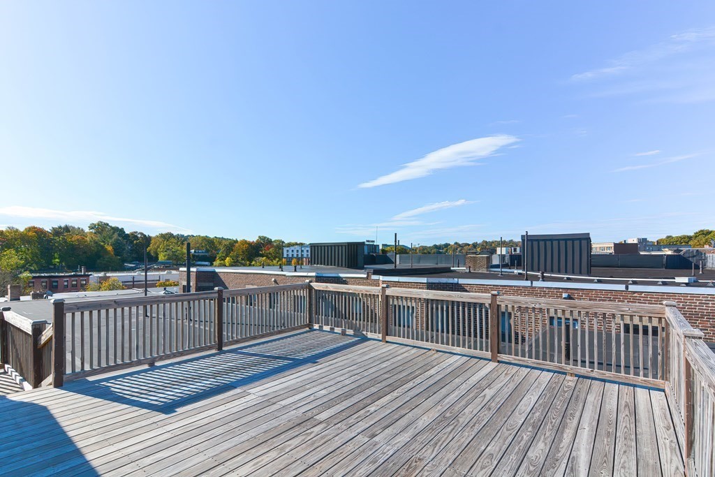 22 Orkney Road, Unit 5 Boston, MA 02135 - Photo 38 of 42 a view of a terrace with wooden floor and fence
