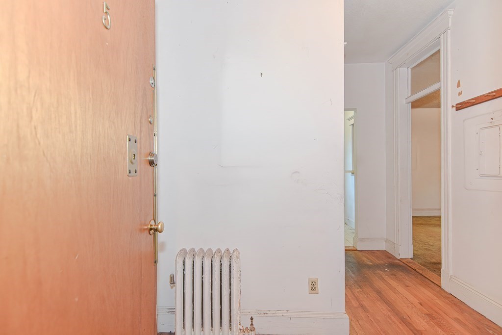 22 Orkney Road, Unit 5 Boston, MA 02135 - Photo 6 of 42 a view of a bedroom with wooden floor