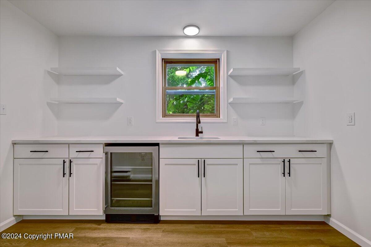6051 Neola Road Stroudsburg, PA 18360 - Photo 16 of 57 a kitchen with a sink and cabinets