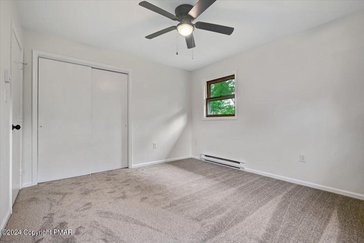 6051 Neola Road Stroudsburg, PA 18360 - Photo 21 of 57 a view of room with window and ceiling fan