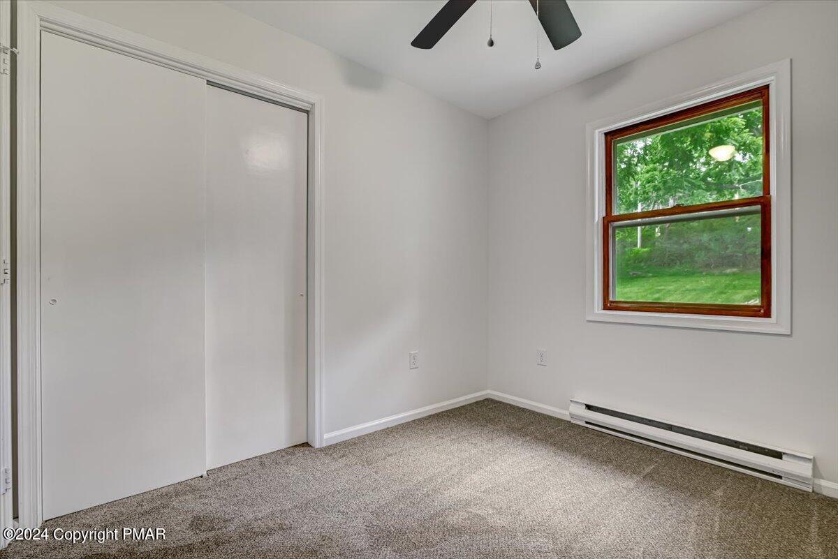 6051 Neola Road Stroudsburg, PA 18360 - Photo 23 of 57 an empty room with a empty space and windows
