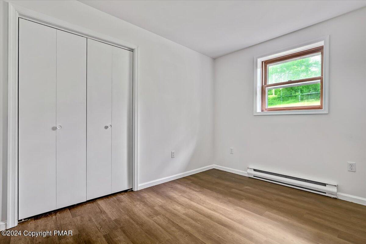 6051 Neola Road Stroudsburg, PA 18360 - Photo 36 of 57 a view of a room with wooden floor and window