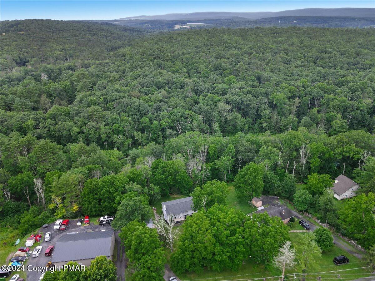 6051 Neola Road Stroudsburg, PA 18360 - Photo 54 of 57 an aerial view of a house with a yard