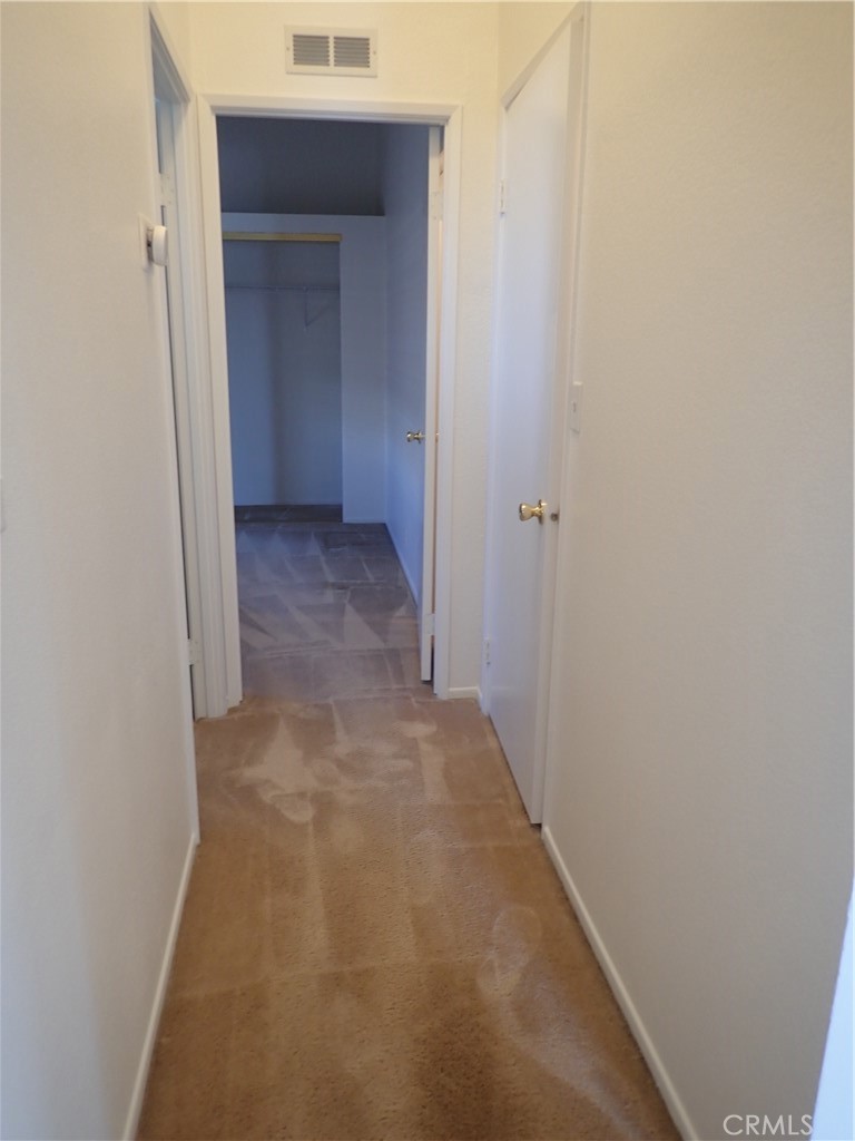 27250 Murrieta Road, Unit 332 Menifee, CA 92586 - Photo 13 of 26 a view of a hallway with closet