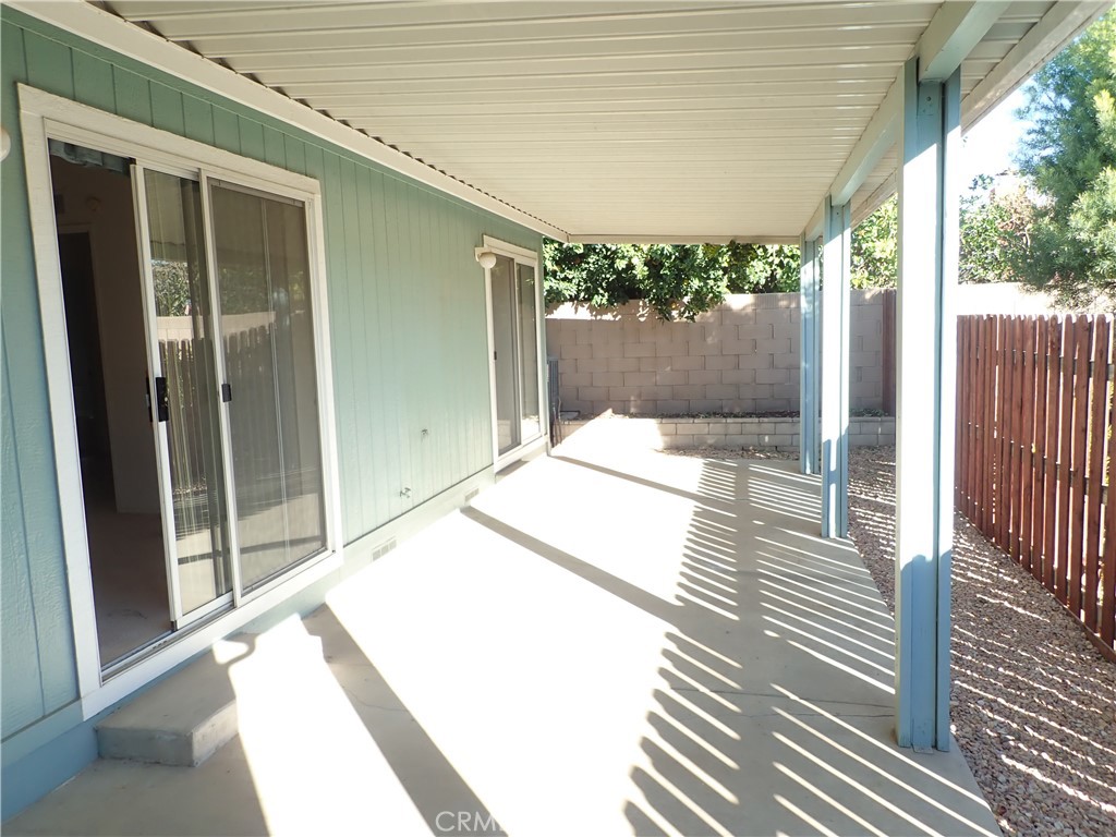 27250 Murrieta Road, Unit 332 Menifee, CA 92586 - Photo 23 of 26 a bathroom with a sink and glass door
