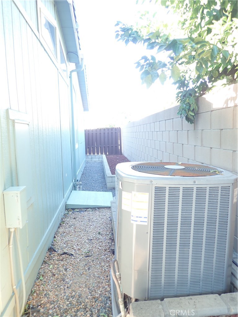 27250 Murrieta Road, Unit 332 Menifee, CA 92586 - Photo 25 of 26 a view of a porch with wooden floor and fence