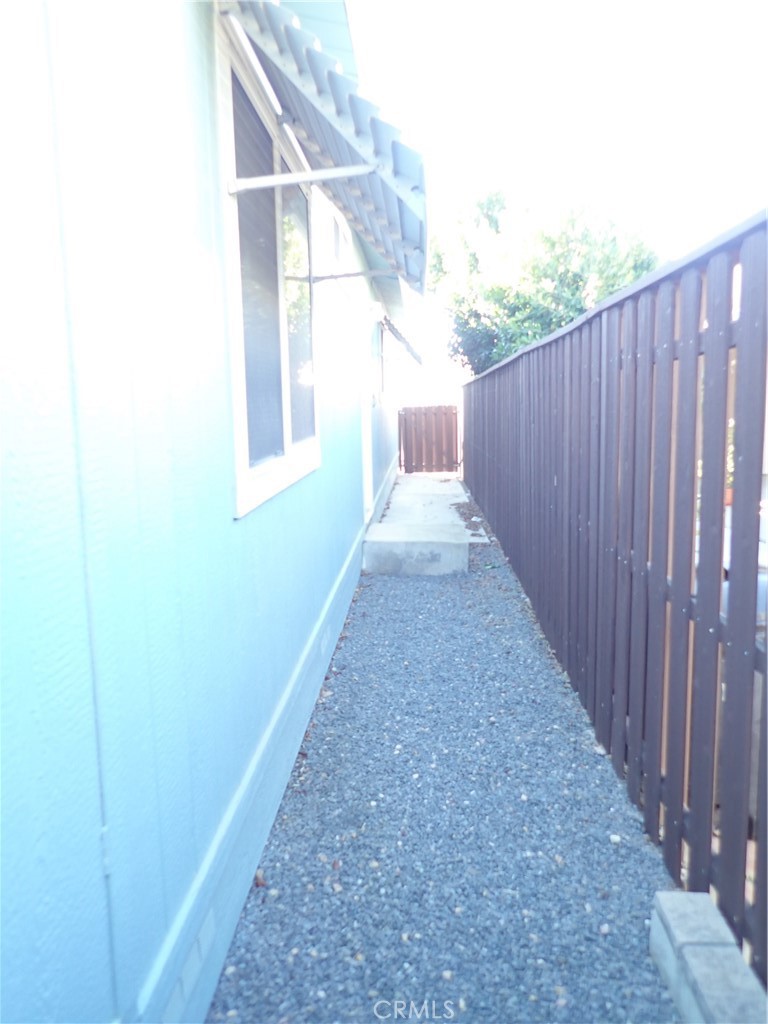 27250 Murrieta Road, Unit 332 Menifee, CA 92586 - Photo 26 of 26 a view of a backyard with wooden fence