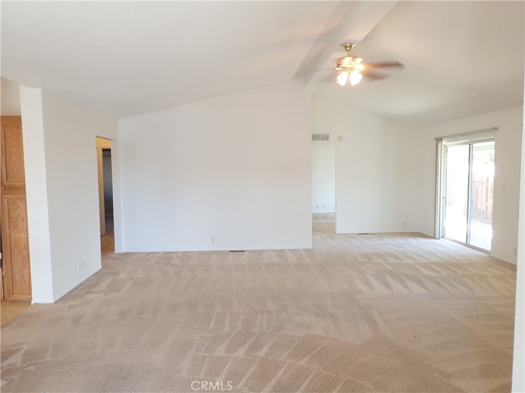 27250 Murrieta Road, Unit 332 Menifee, CA 92586 - Photo 5 of 26 a view of an empty room with a chandelier fan