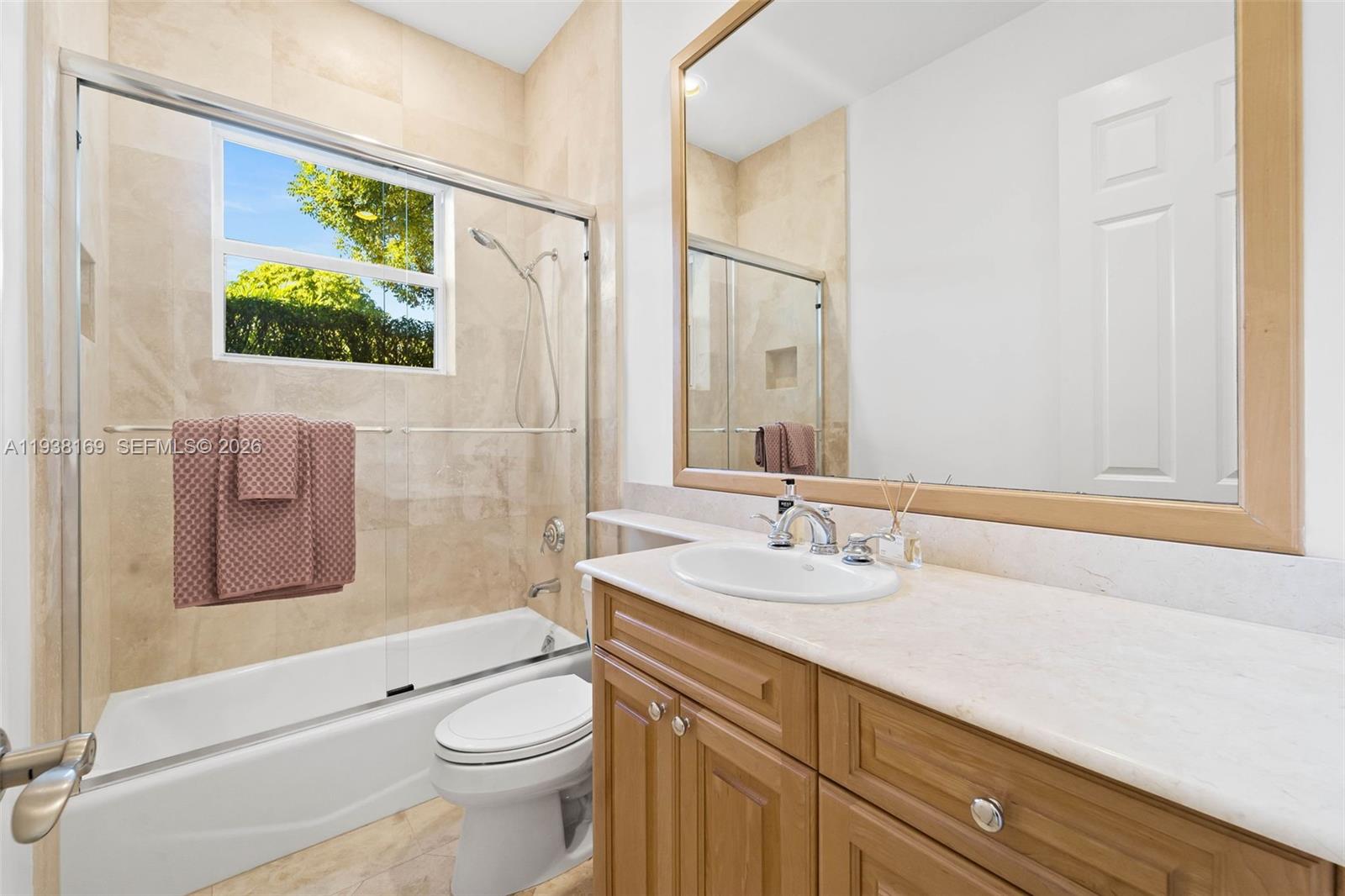1490 Cleveland Road Miami Beach, FL 33141 - Photo 21 of 38 a bathroom with a granite countertop sink mirror vanity and toilet
