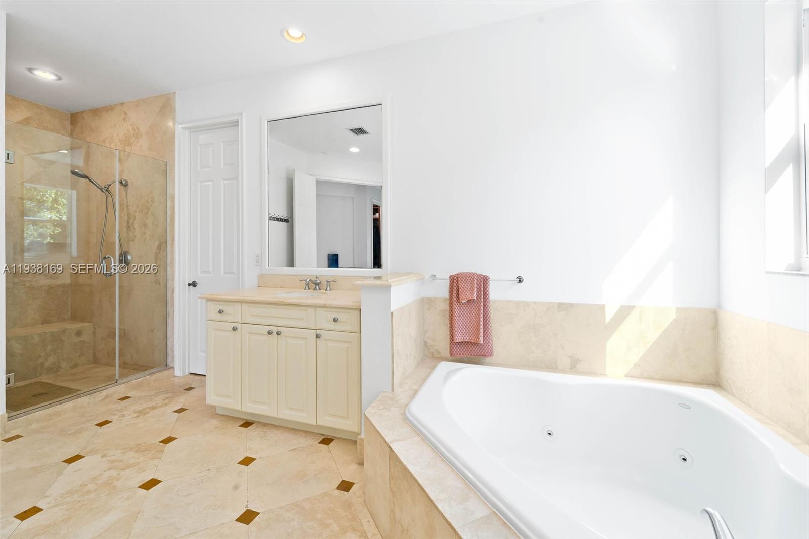1490 Cleveland Road Miami Beach, FL 33141 - Photo 22 of 38 a bathroom with a tub sink and a shower