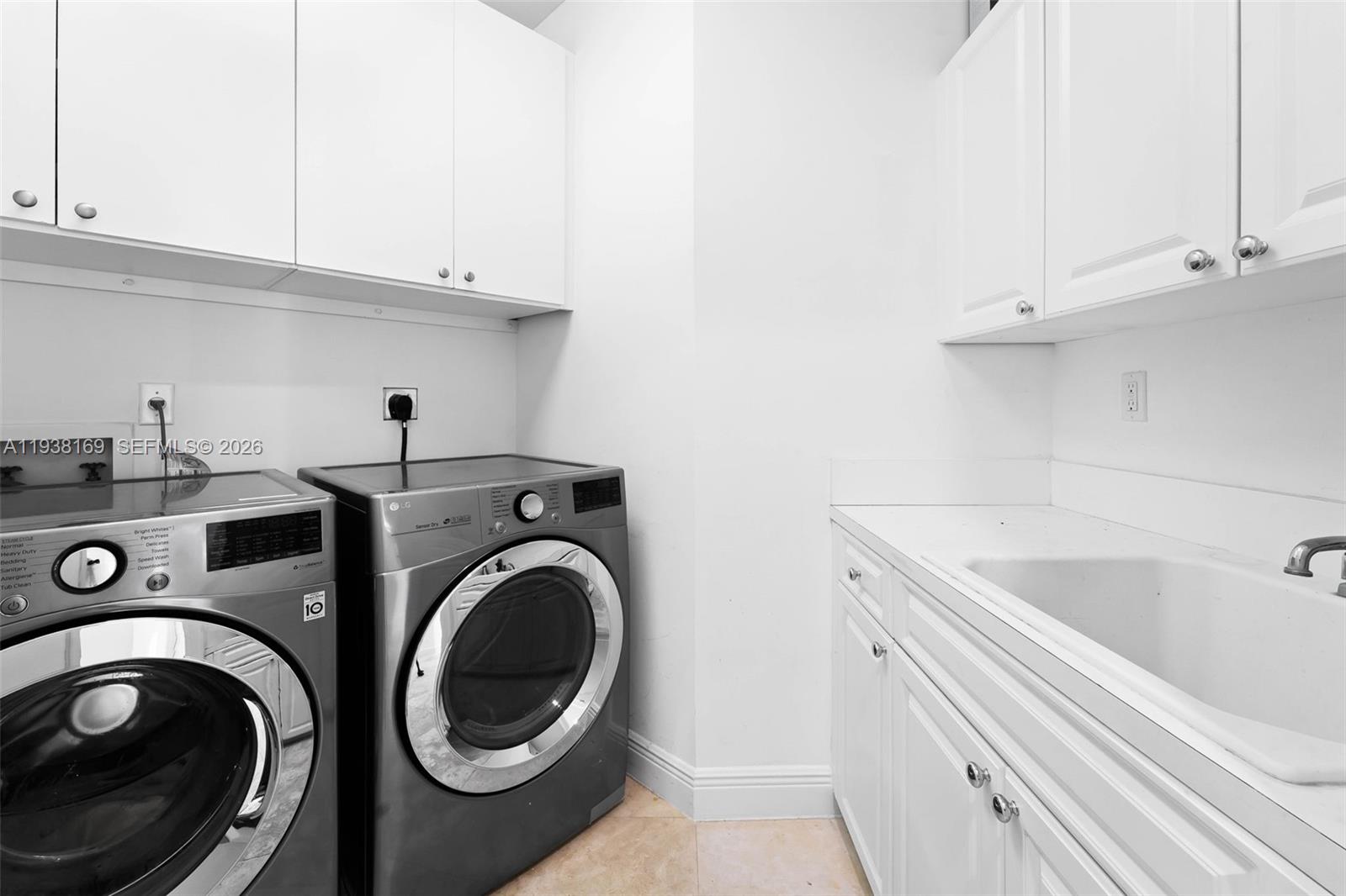 1490 Cleveland Road Miami Beach, FL 33141 - Photo 25 of 38 a utility room with sink dryer and washer