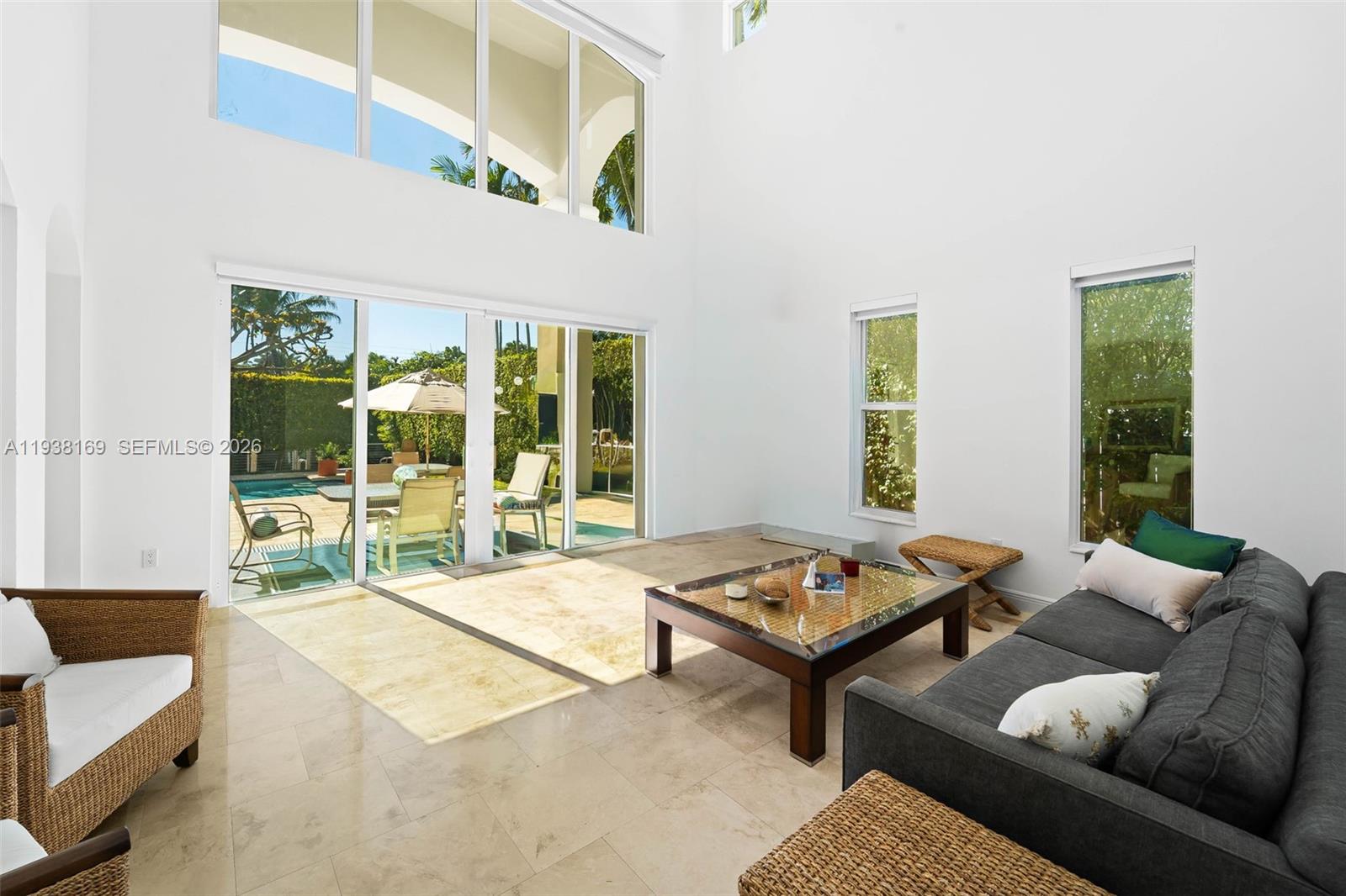 1490 Cleveland Road Miami Beach, FL 33141 - Photo 26 of 38 a living room with furniture and a large window