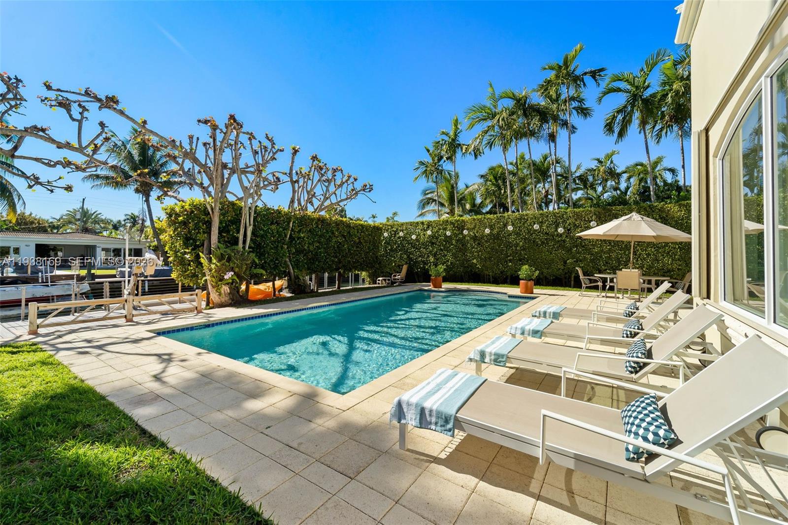 1490 Cleveland Road Miami Beach, FL 33141 - Photo 30 of 38 a view of a patio with a table and chairs under an umbrella