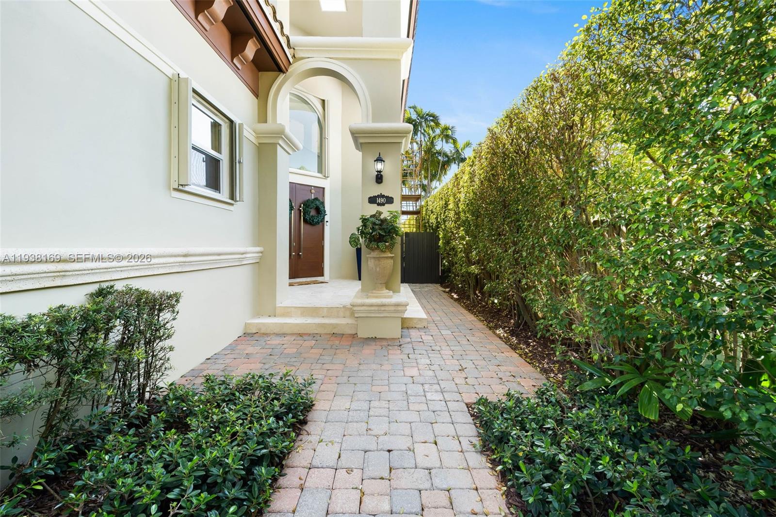 1490 Cleveland Road Miami Beach, FL 33141 - Photo 3 of 38 a view of a pathway with a house