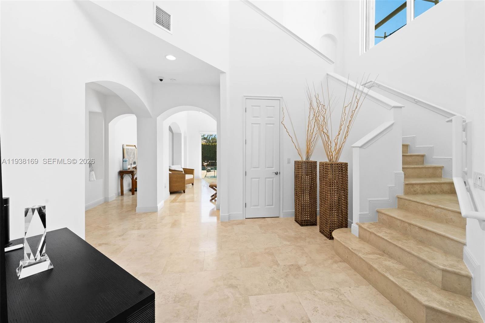 1490 Cleveland Road Miami Beach, FL 33141 - Photo 6 of 38 a view of a living room with staircase