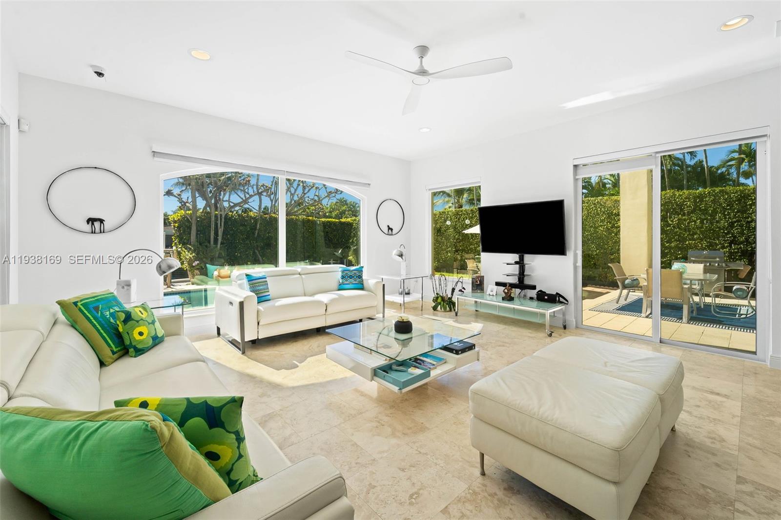 1490 Cleveland Road Miami Beach, FL 33141 - Photo 7 of 38 a living room with furniture and a flat screen tv
