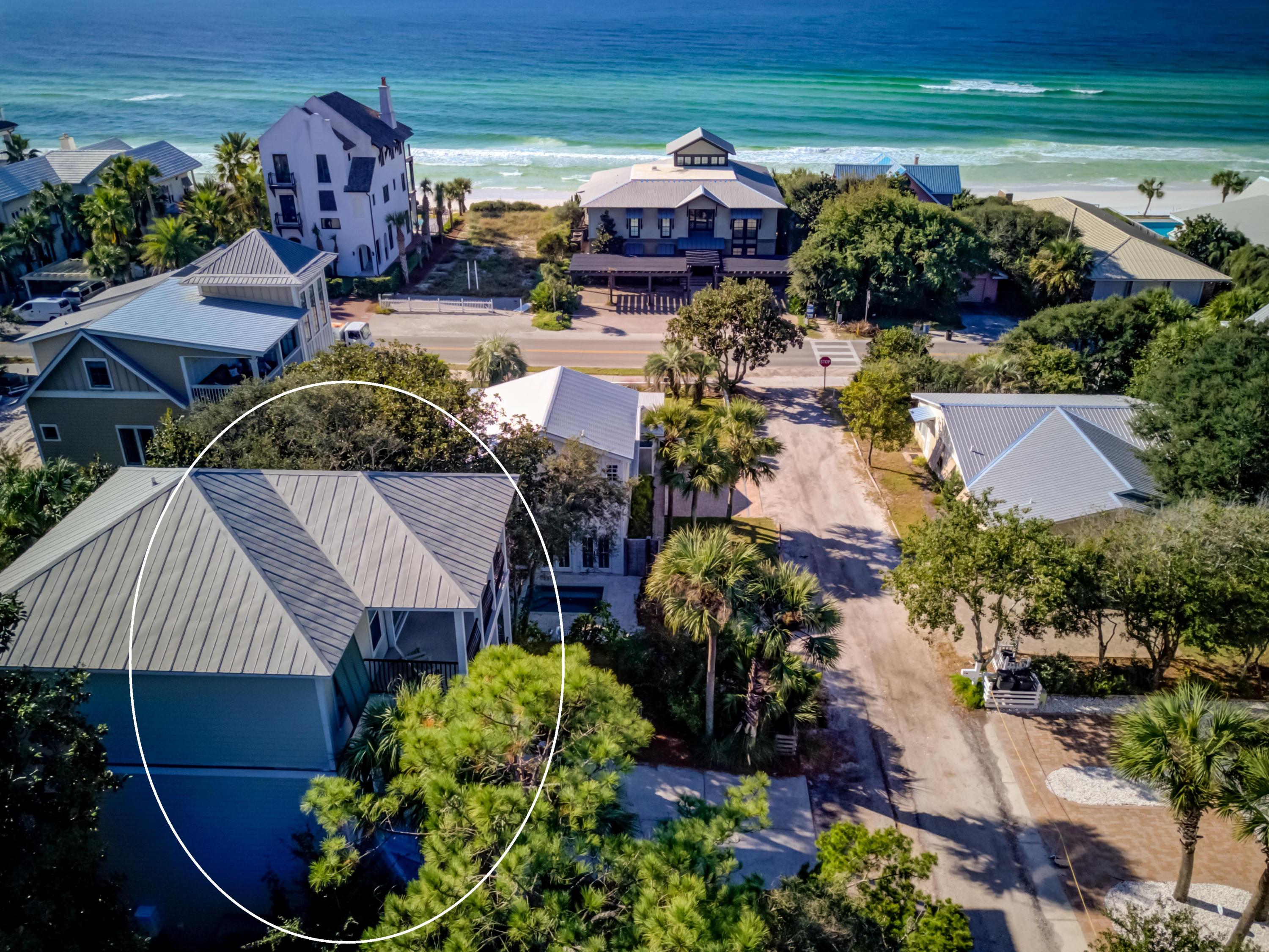 a aerial view of a house with garden space and street view