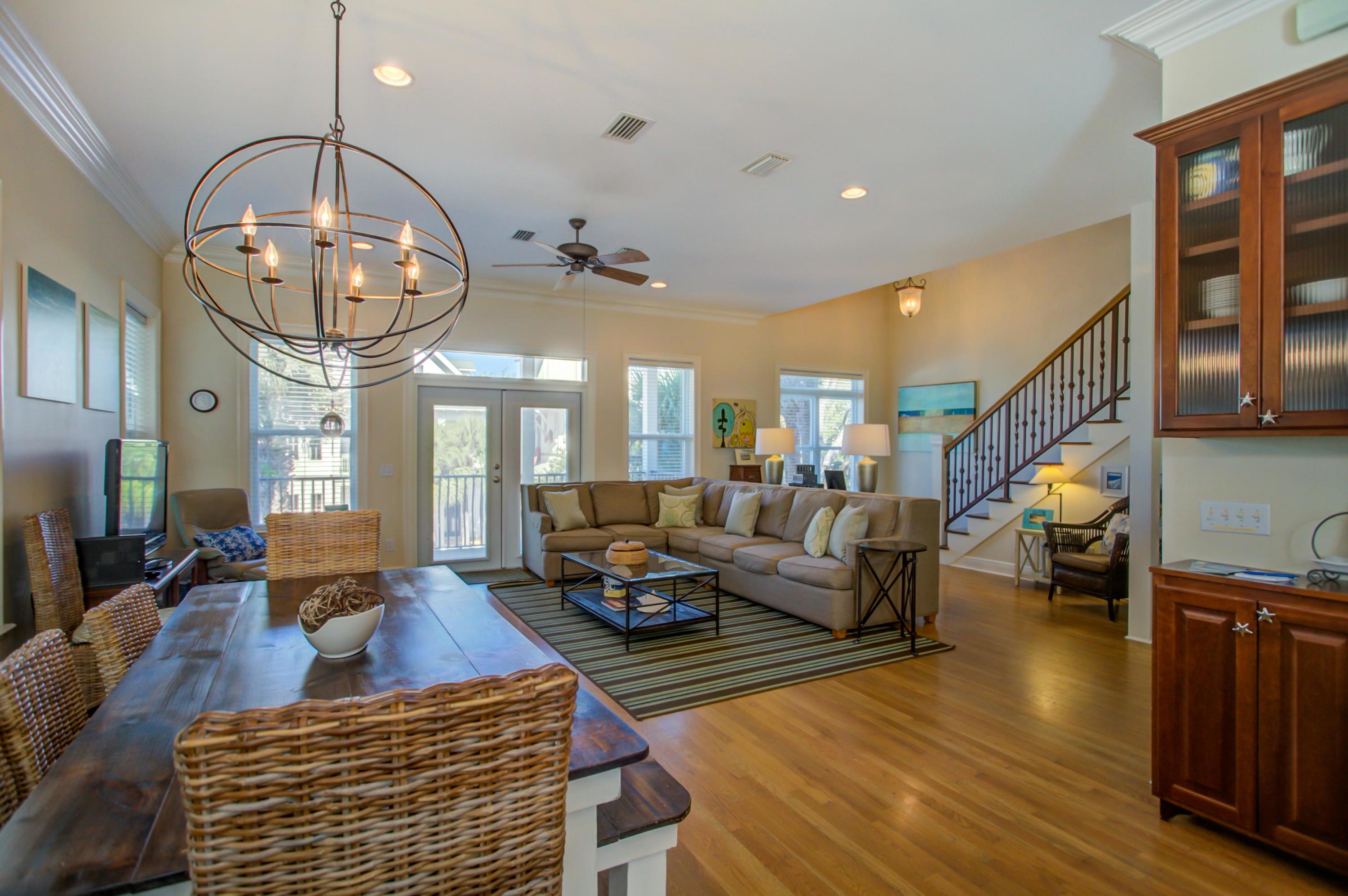 32 Hickory Street Santa Rosa Beach, FL 32459 - Photo 13 of 43 a living room with couches a dining table and chairs with wooden floor