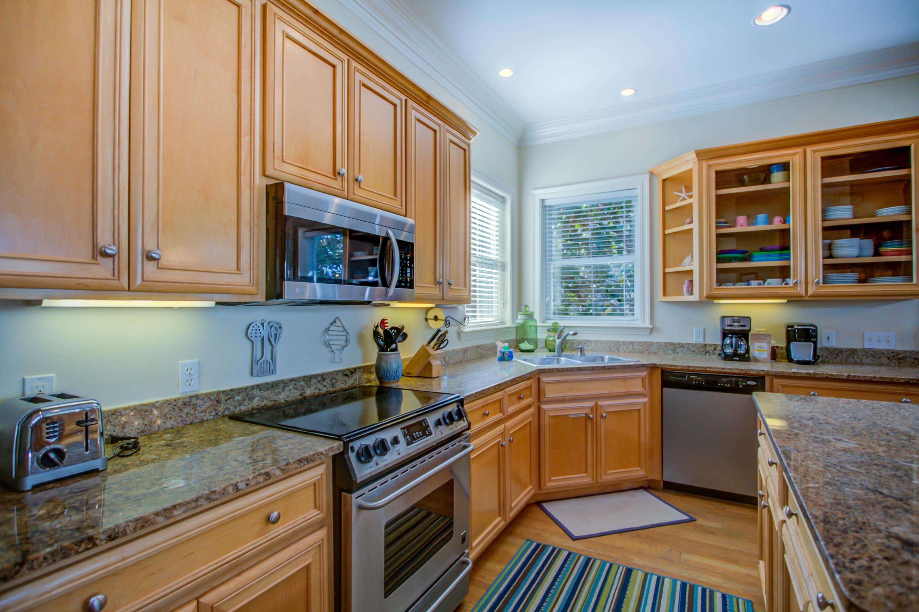 32 Hickory Street Santa Rosa Beach, FL 32459 - Photo 15 of 43 a kitchen with stainless steel appliances granite countertop a sink stove and cabinets