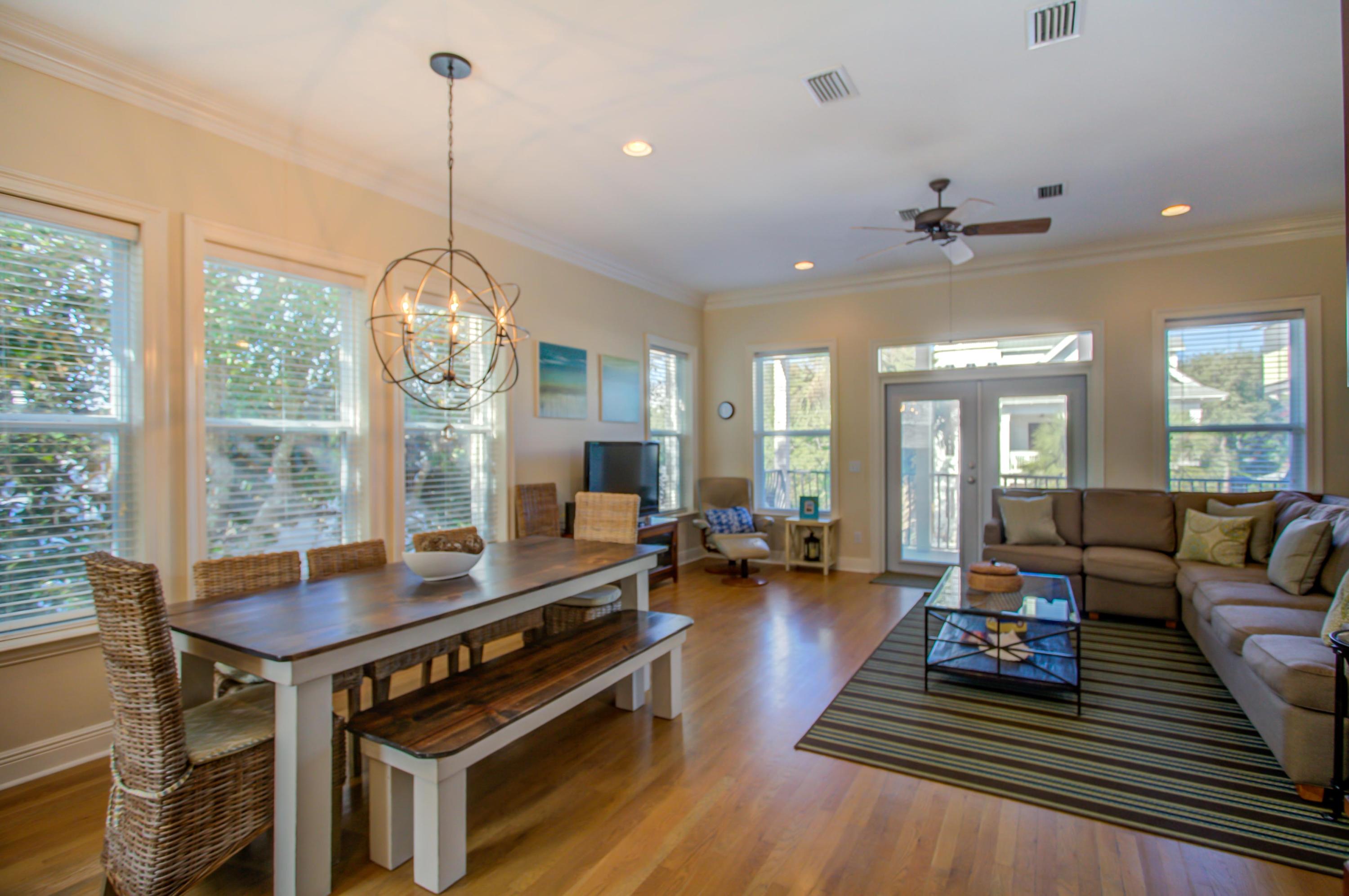32 Hickory Street Santa Rosa Beach, FL 32459 - Photo 17 of 43 a living room with furniture a chandelier and a table