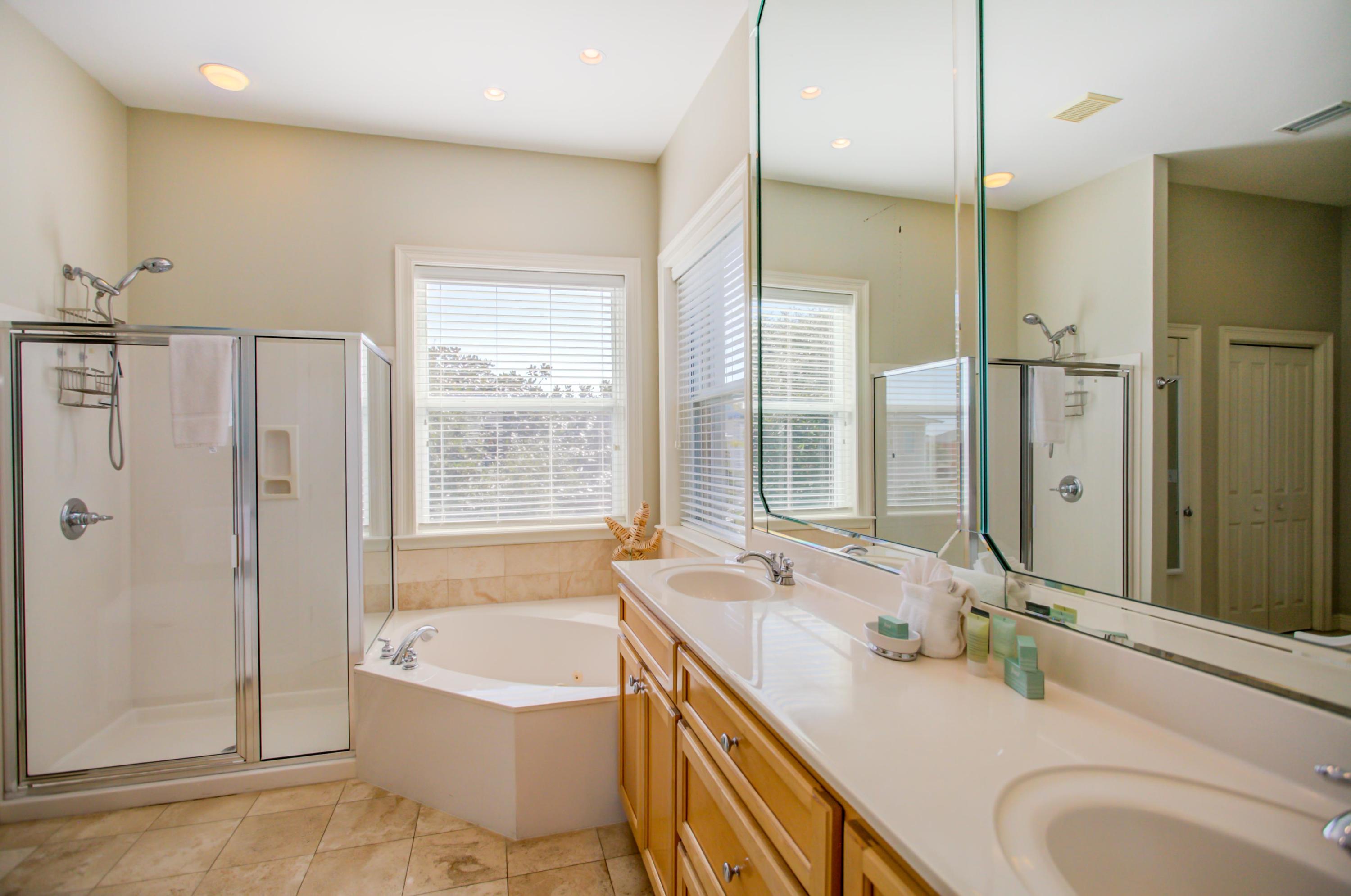 32 Hickory Street Santa Rosa Beach, FL 32459 - Photo 23 of 43 a bathroom with a granite countertop tub sink and mirror