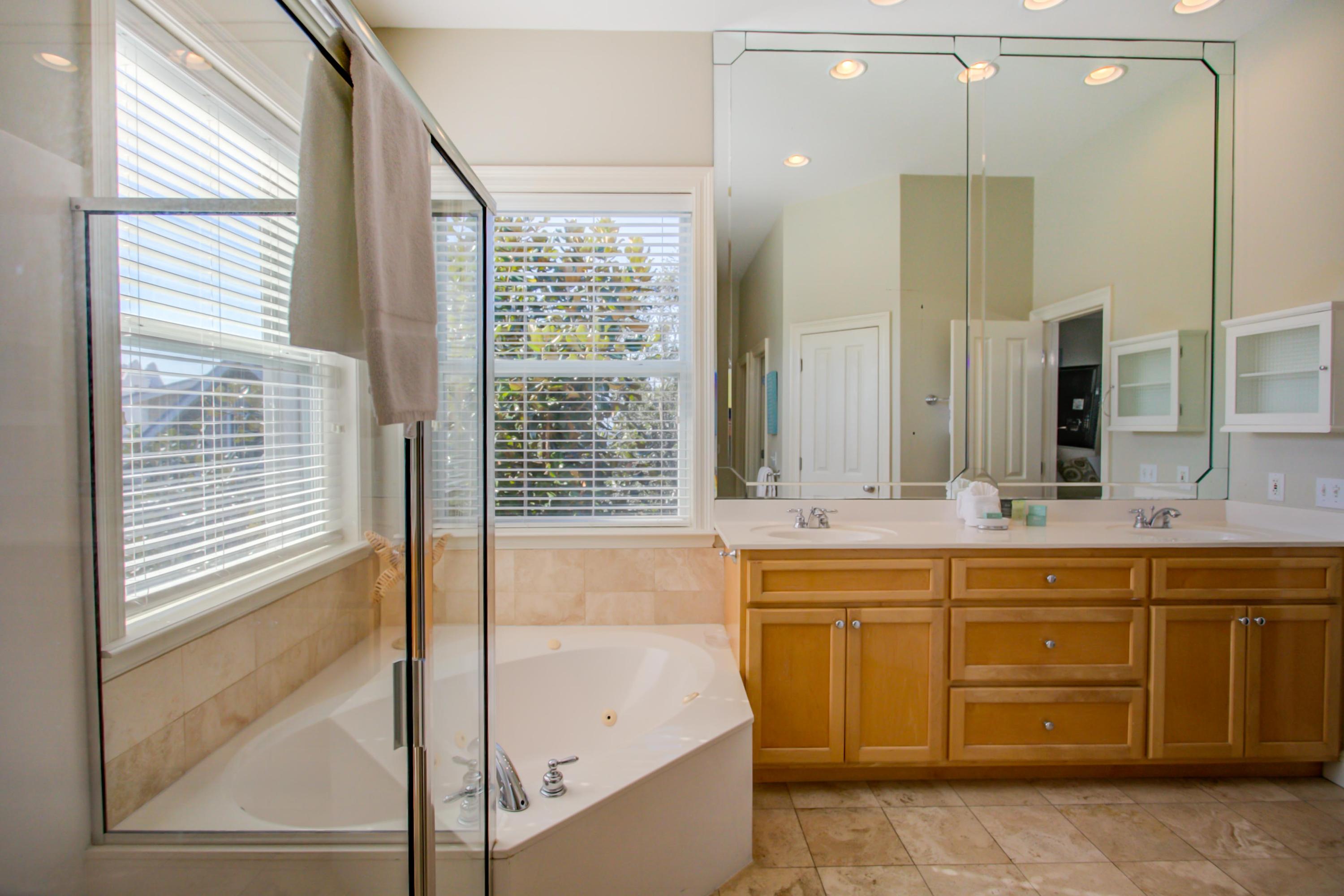 32 Hickory Street Santa Rosa Beach, FL 32459 - Photo 24 of 43 a bathroom with a tub sink and mirror