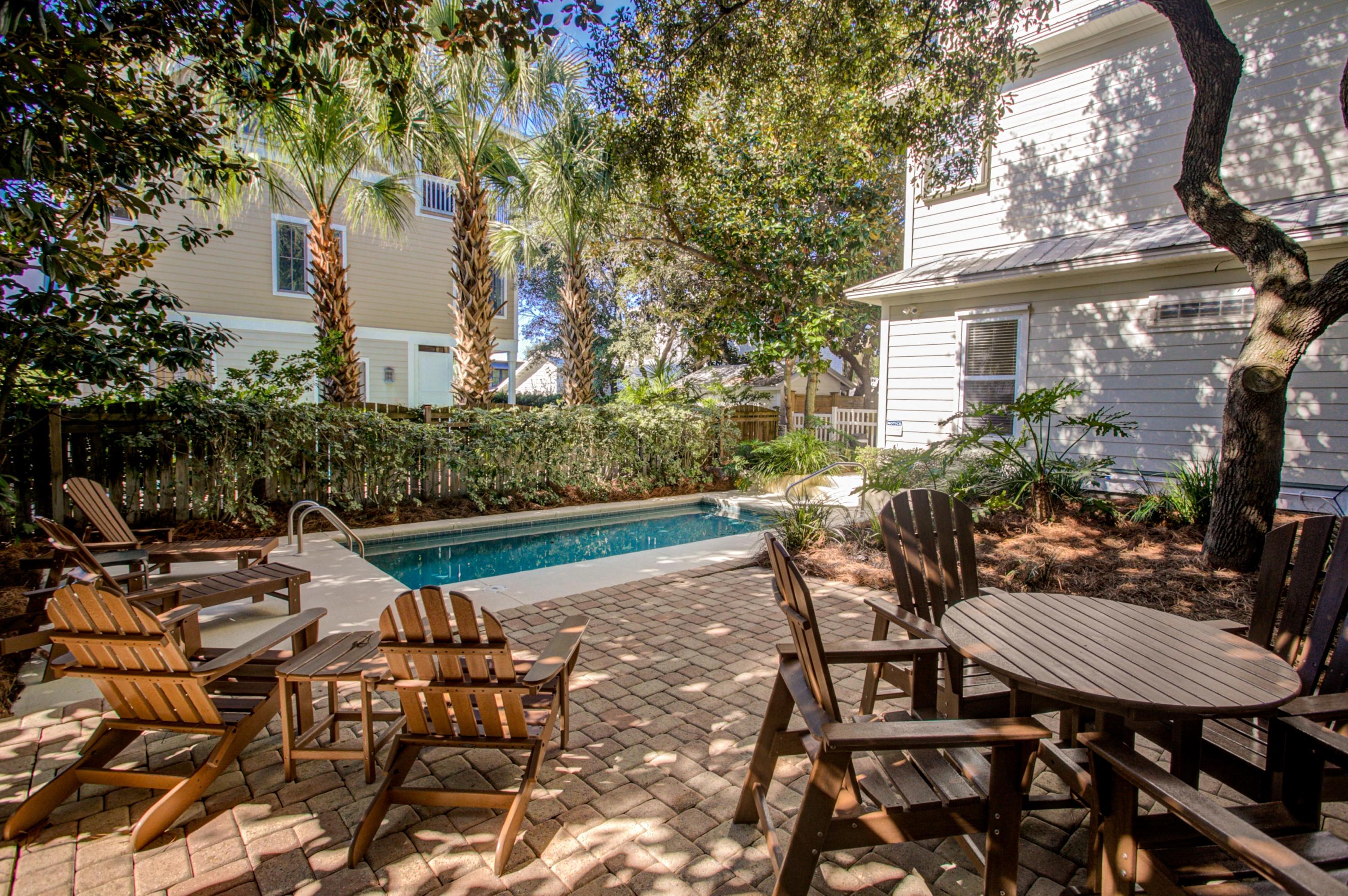 32 Hickory Street Santa Rosa Beach, FL 32459 - Photo 36 of 43 a view of a patio with table and chairs and potted plants