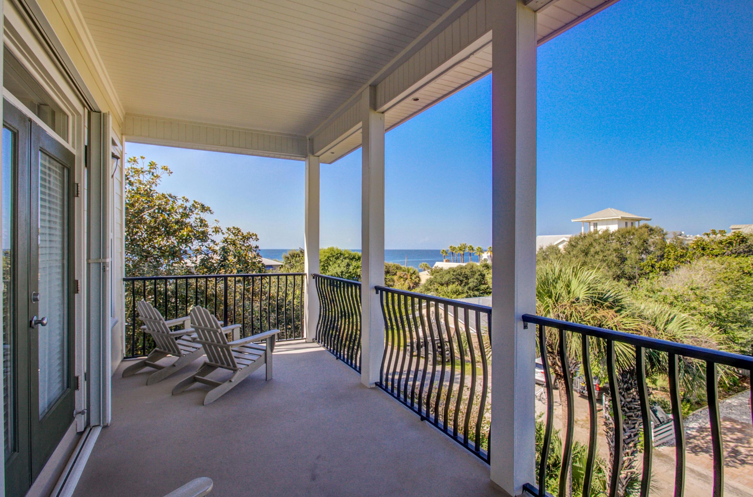 32 Hickory Street Santa Rosa Beach, FL 32459 - Photo 40 of 43 a view of balcony with couches and wooden floor