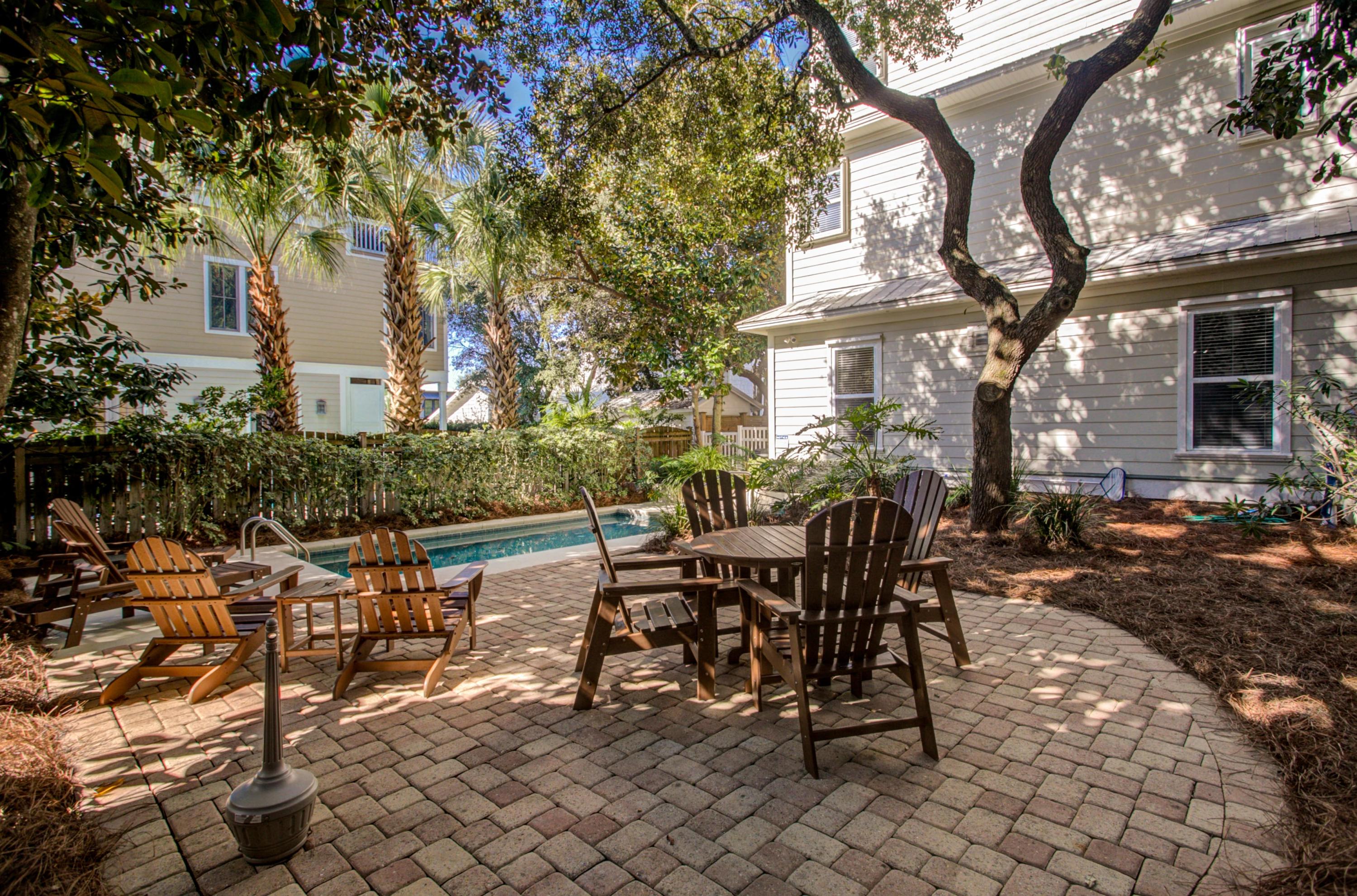 32 Hickory Street Santa Rosa Beach, FL 32459 - Photo 7 of 43 a view of a patio with table and chairs and potted plants