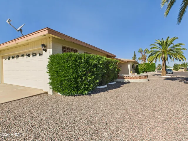a view of a porch and garden