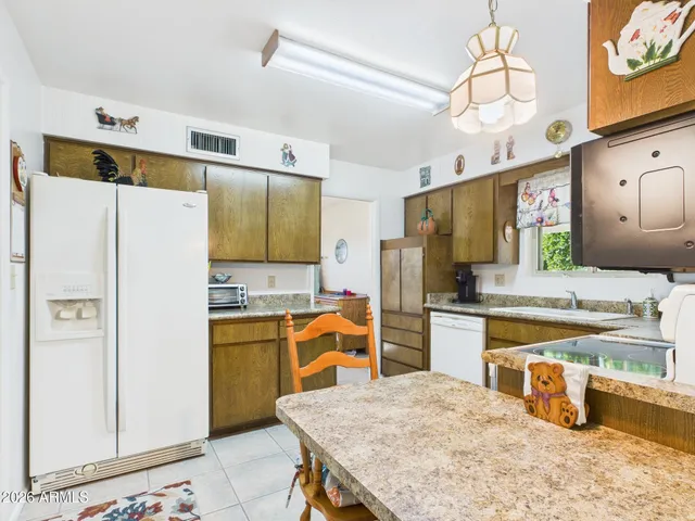 a living room with furniture a table and a bookshelf
