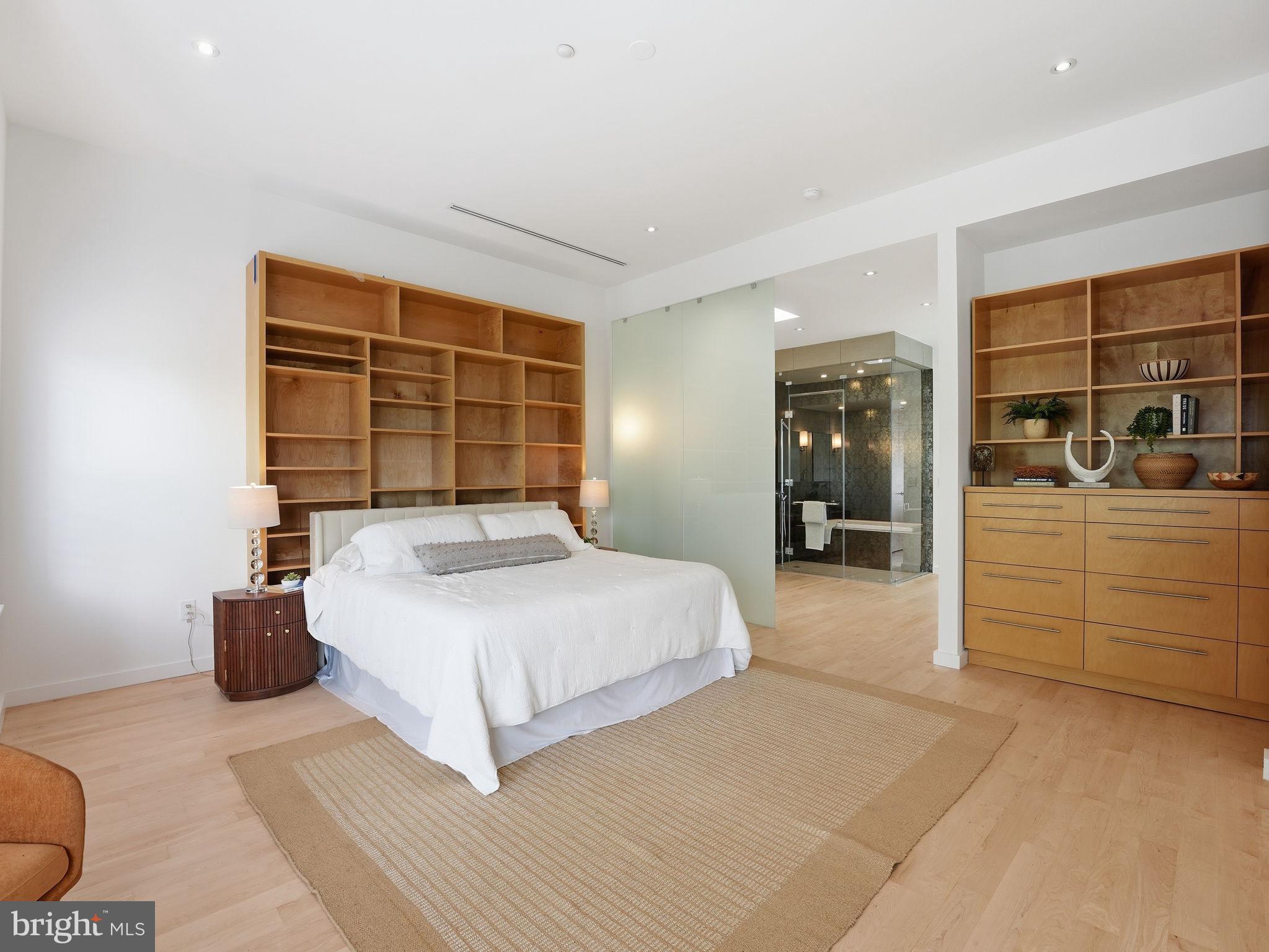 1845 Calvert Street Northwest Washington, DC 20009 - Photo 21 of 48 a bedroom with a bed and a window