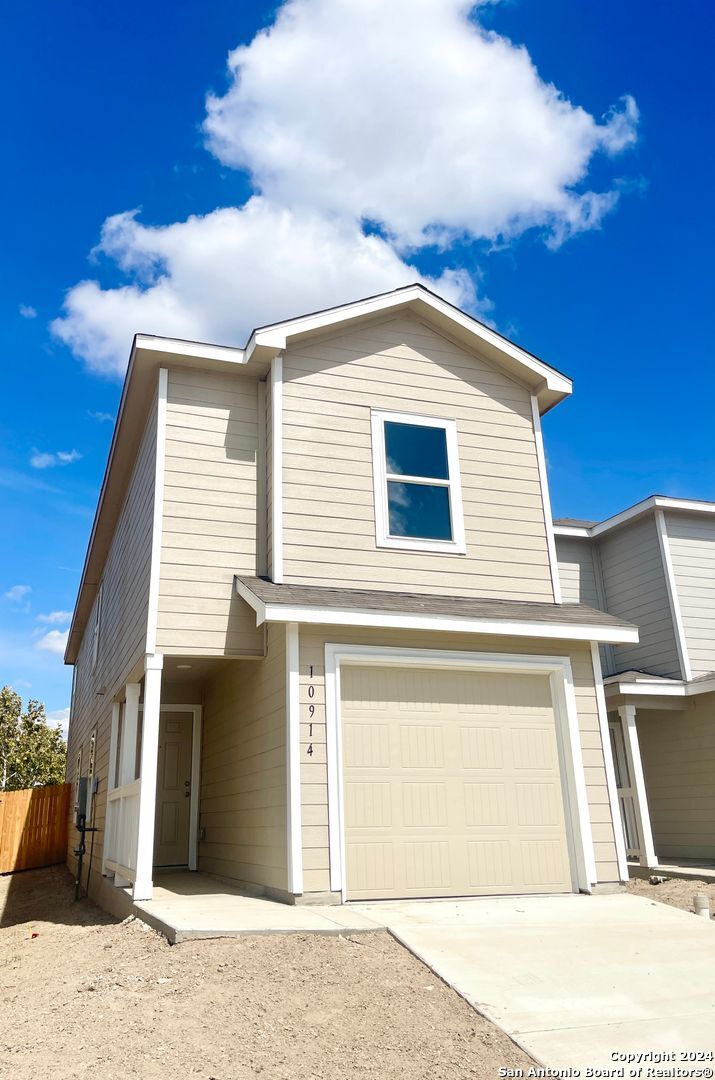 a view of a house with a garage