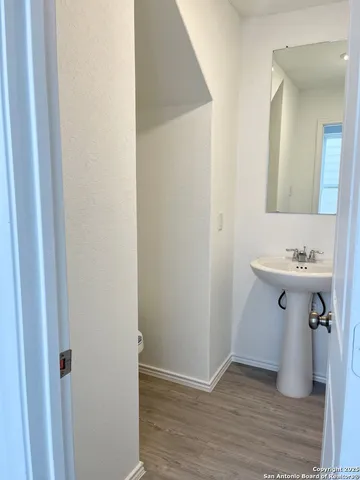 a bathroom with a sink and mirror