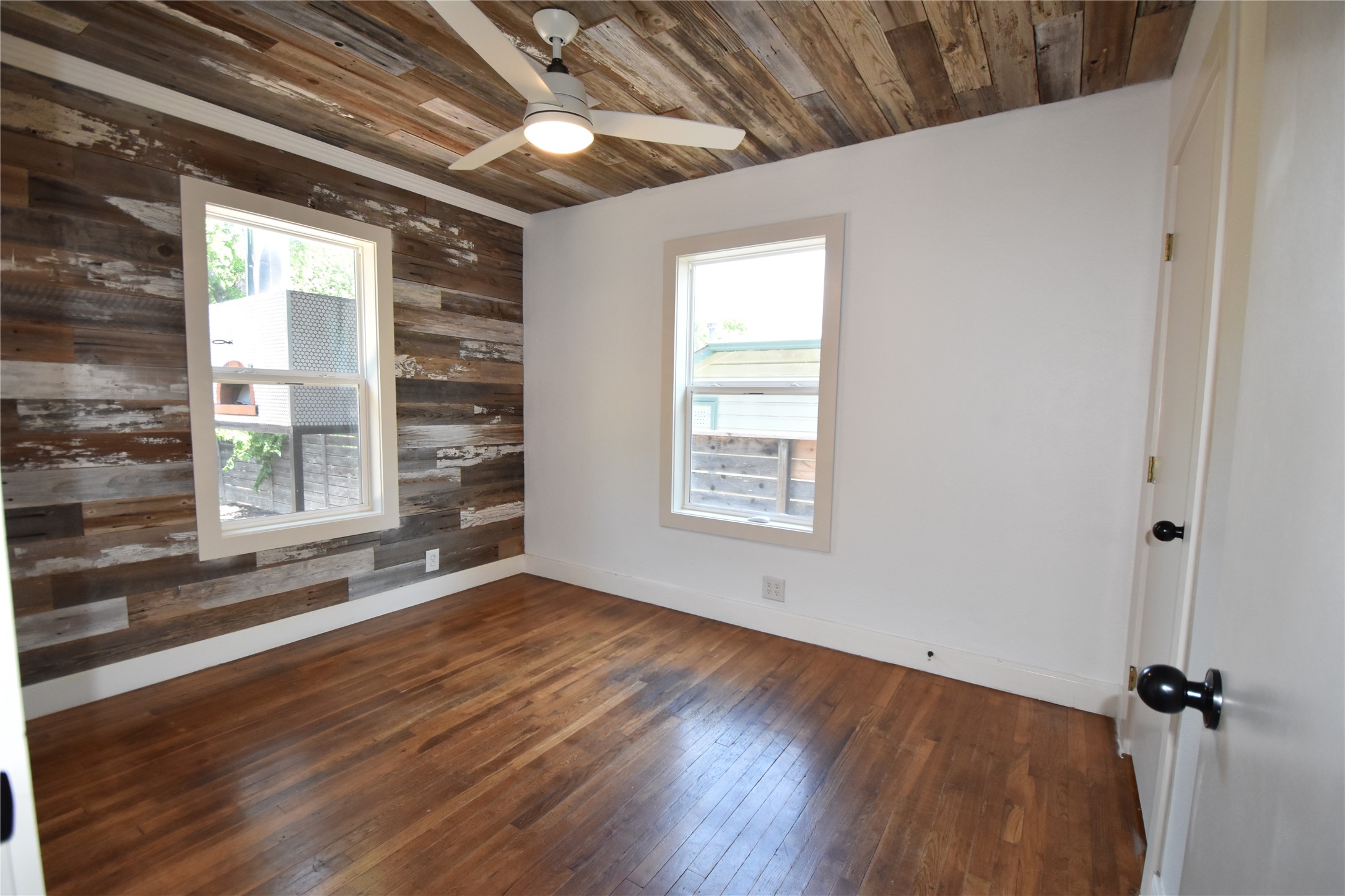 2012 Payne Avenue, Unit A Austin, TX 78757 - Photo 24 of 33 wood plank wood ceiling and walls for that unique bedroom/office